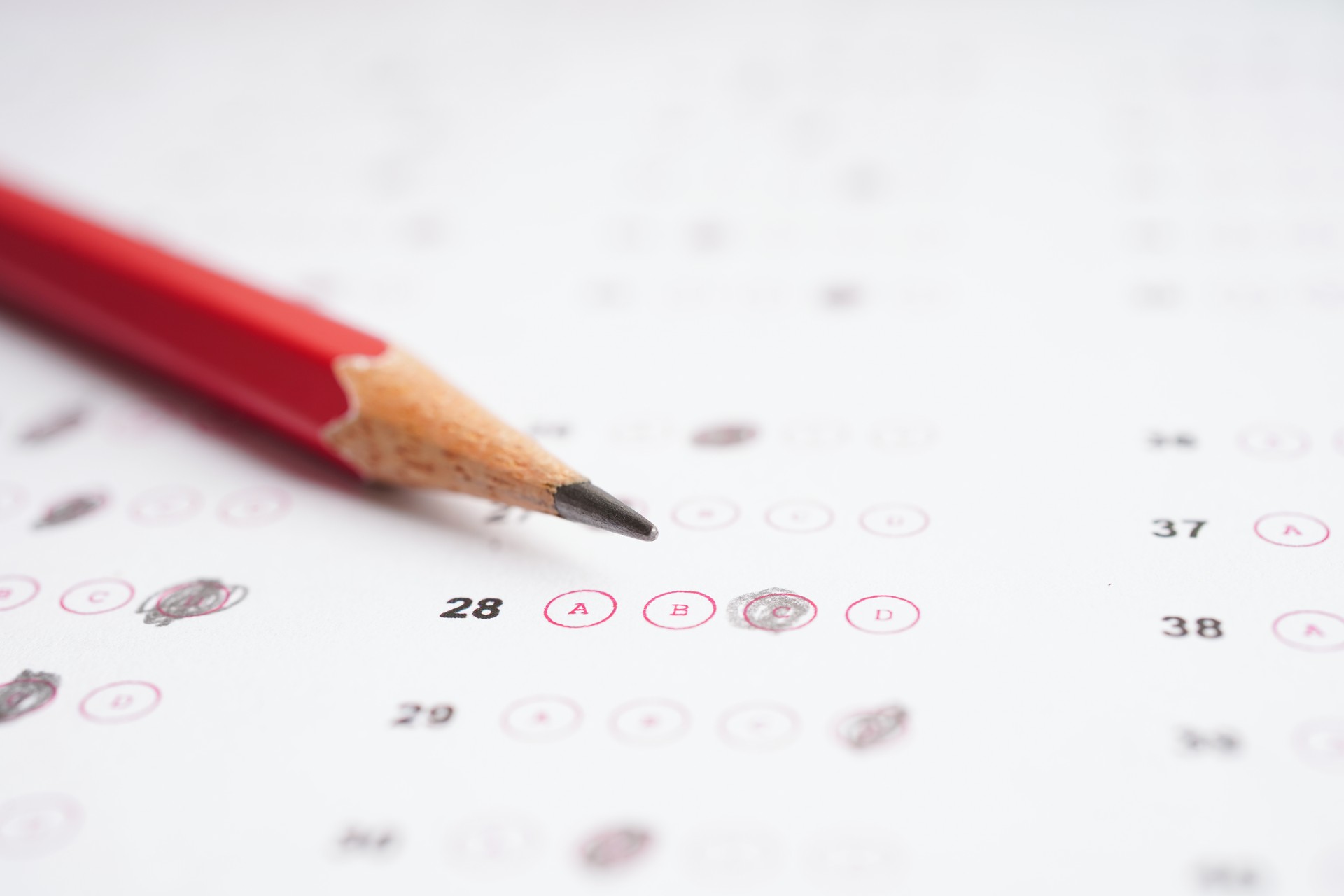 Answer sheets with pencil drawing fill to select choice, education concept.