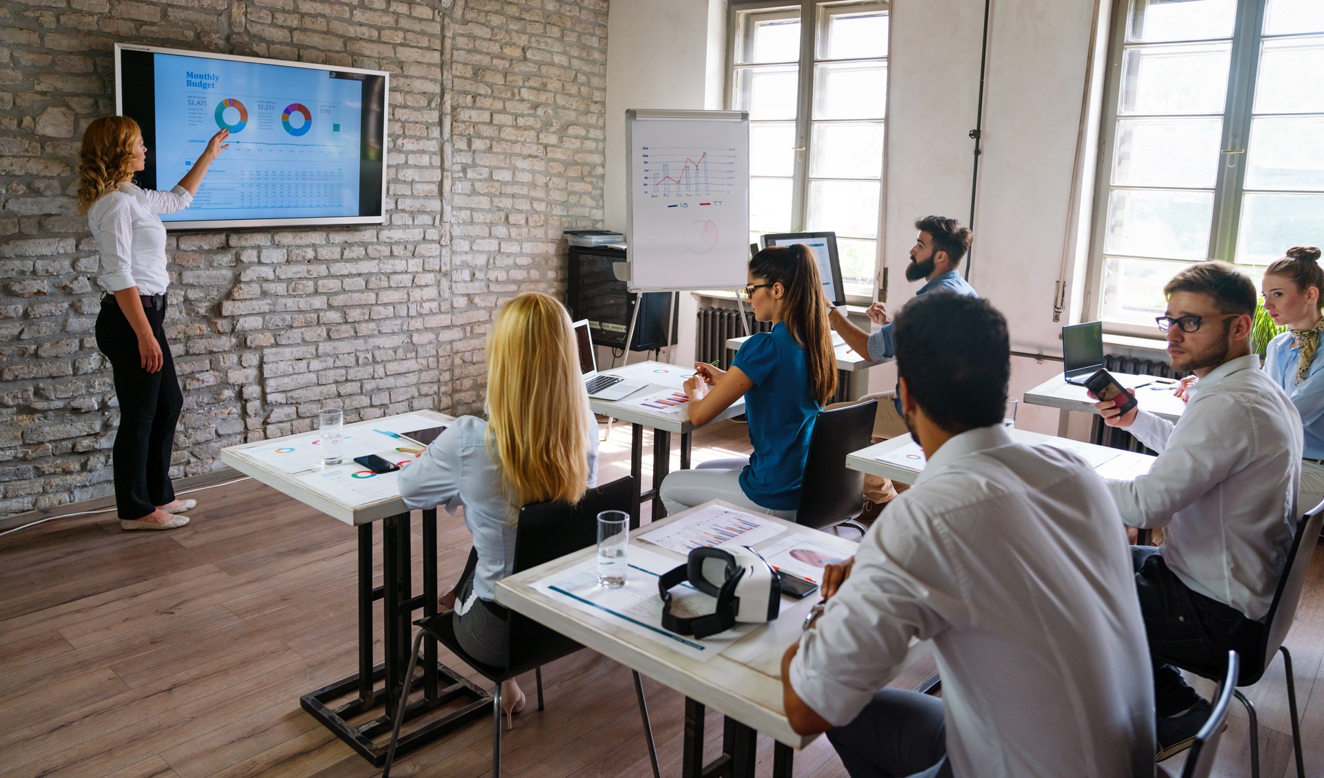 Group of multinational business people develop themselves in business training, meeting in office